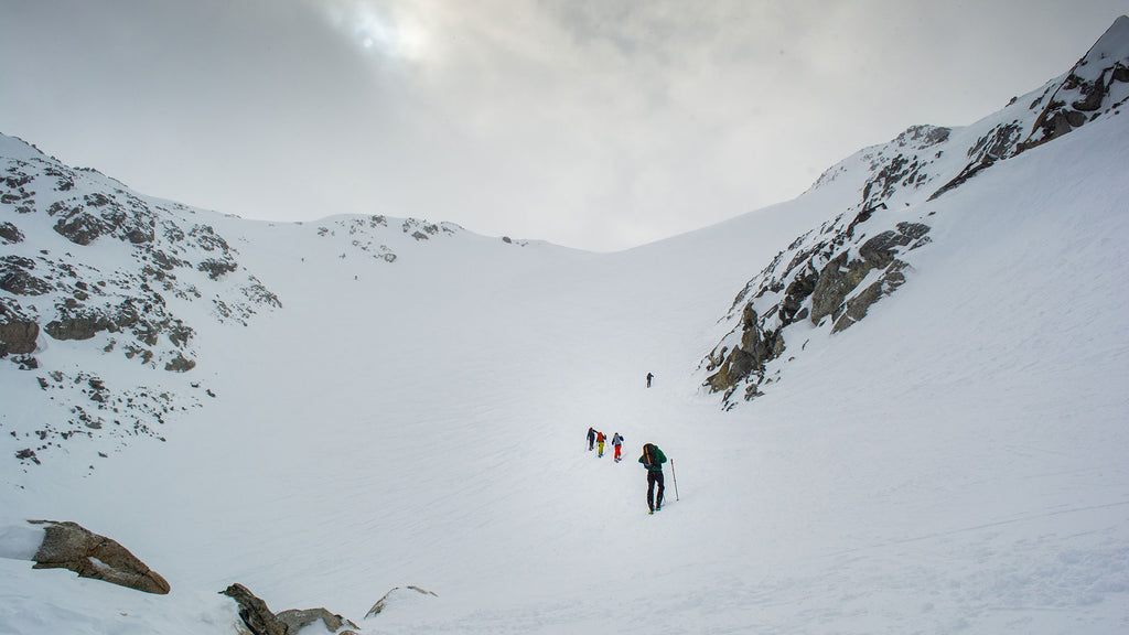 view of skiers ascending into the backcountry at the Blackcomb Backcountry gates