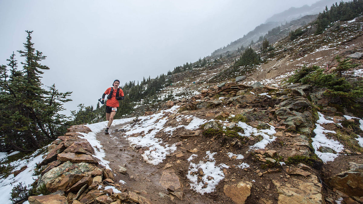 Zach, Escape Route employee, photographed by Brian McCurdy trail running in the alpine.