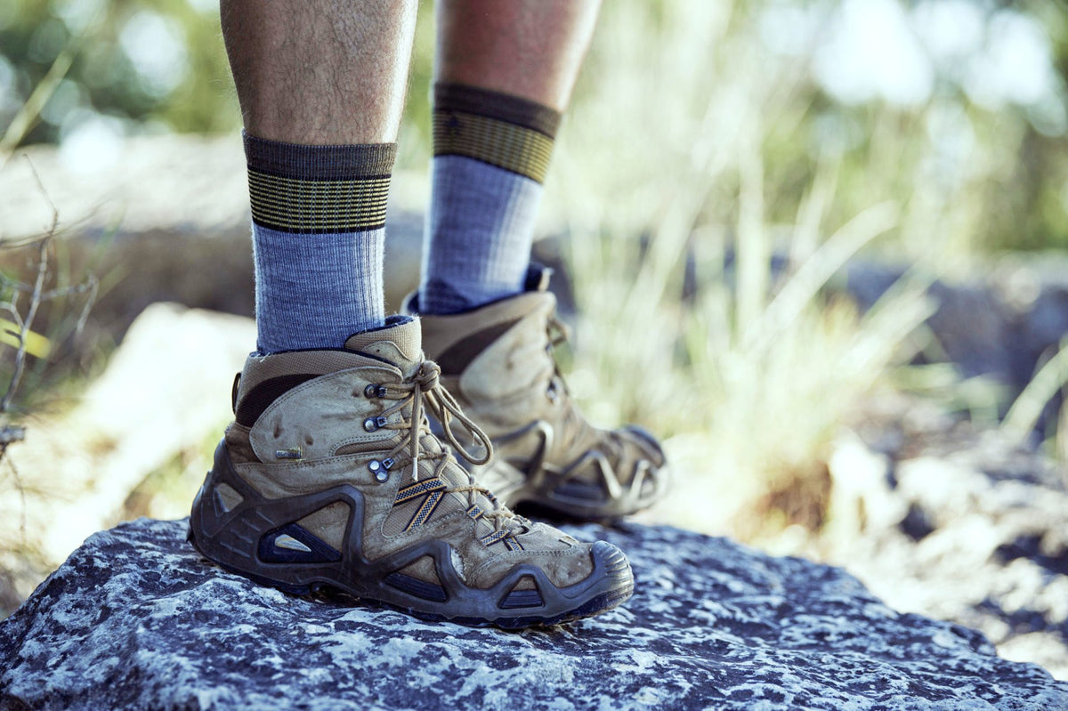 Hiker wearing merino wool socks in a hiking shoe