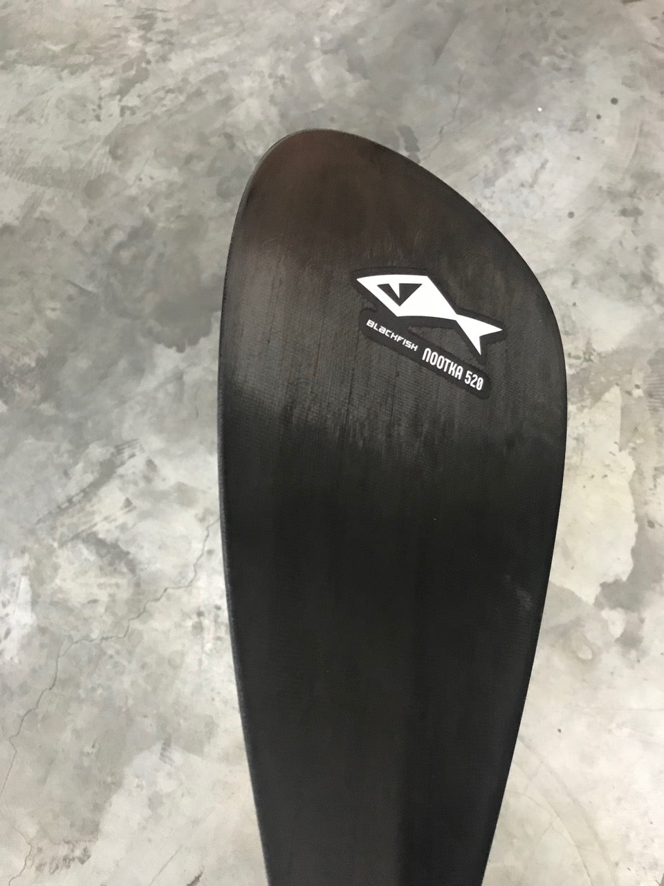 side shot of custom carbon paddle