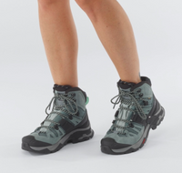 Salomon Quest 4 GTX slate/trooper womens shoe model wearing the pair